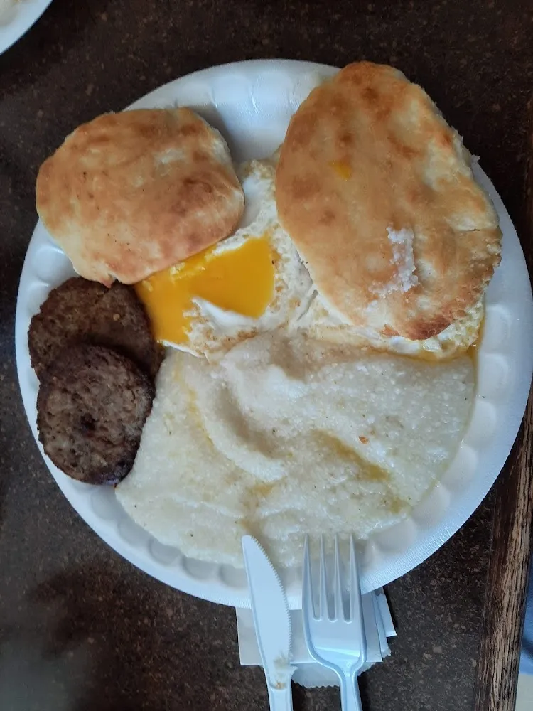Grits 2 Sausage Patties 2 Eggs over Easy and 2 Biscuit
