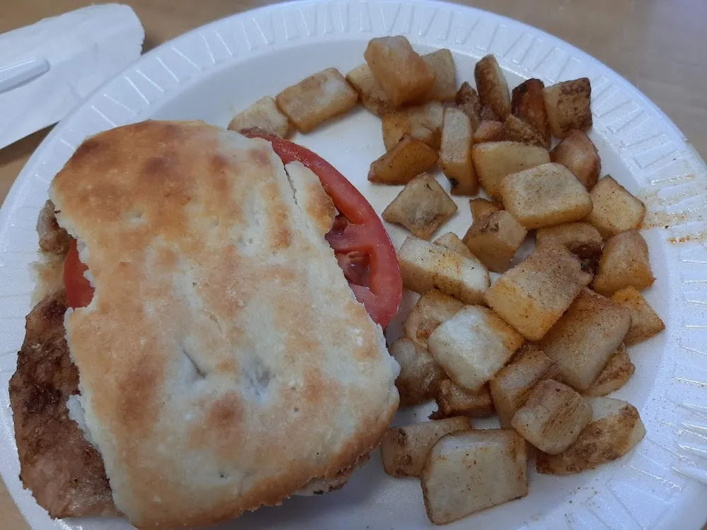 Tenderloin Biscuit with Tomato and Hash Browns